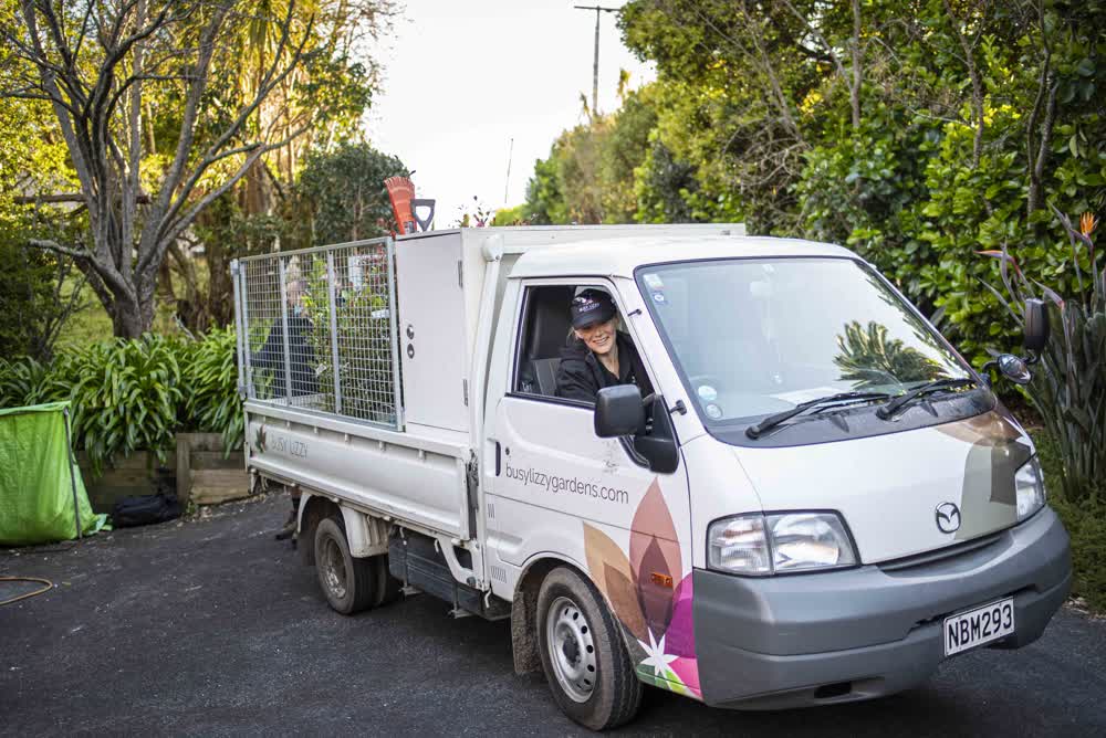 Happy driver behind the wheel of the Busy Lizzy truck